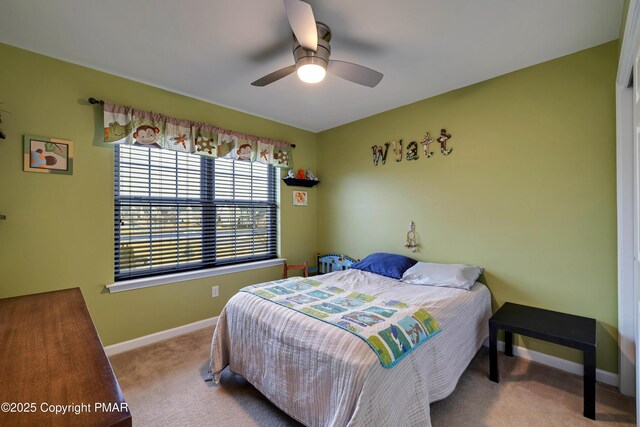 carpeted bedroom with ceiling fan