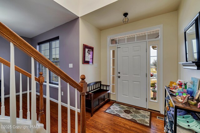 foyer entrance with hardwood / wood-style floors