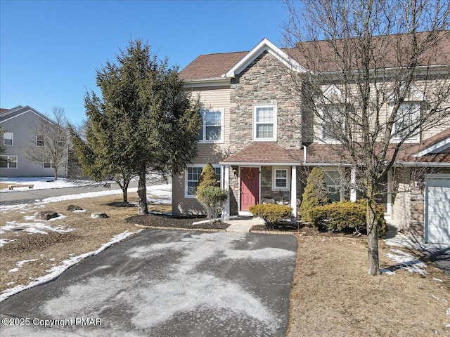 view of property featuring stone siding