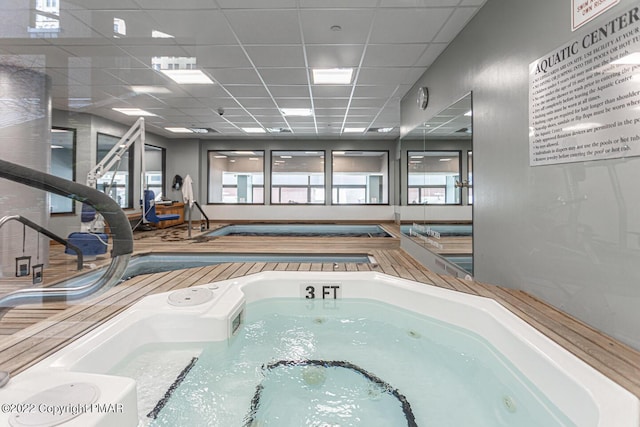 view of pool featuring a jacuzzi