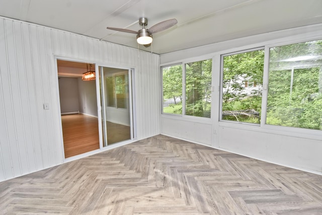 207 Shepard Ave, Delaware Water Gap, PA 18327 - unfurnished sunroom with ceiling fan, plenty of natural light, baseboard heating, and wood walls