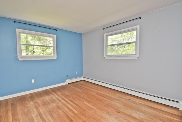 207 Shepard Ave, Delaware Water Gap, PA 18327 - unfurnished room with a baseboard heating unit, plenty of natural light, wood finished floors, and baseboards