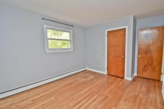 207 Shepard Ave, Delaware Water Gap, PA 18327 - unfurnished bedroom featuring baseboard heating, light wood-style flooring, and baseboards