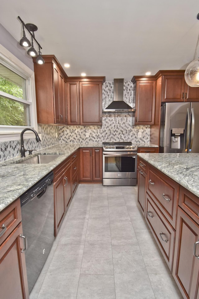 207 Shepard Ave, Delaware Water Gap, PA 18327 - kitchen with appliances with stainless steel finishes, wall chimney range hood, a sink, decorative backsplash, and light stone countertops