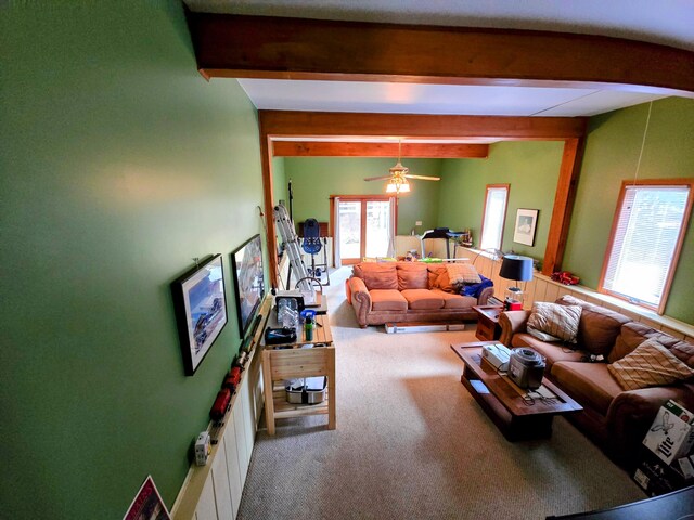 living room with carpet and beam ceiling