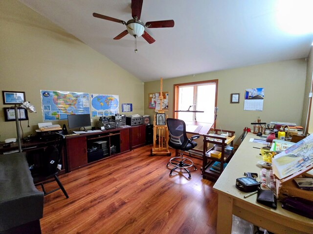 home office with lofted ceiling, ceiling fan, and wood finished floors