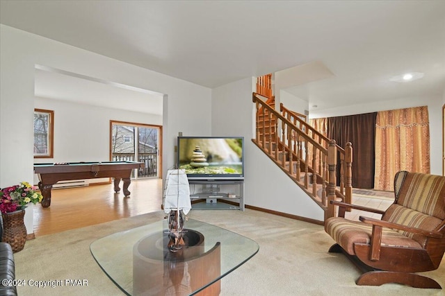 carpeted living area with billiards, stairway, and baseboards