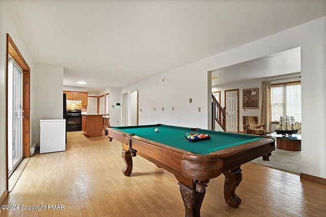 rec room with billiards and light wood-style flooring