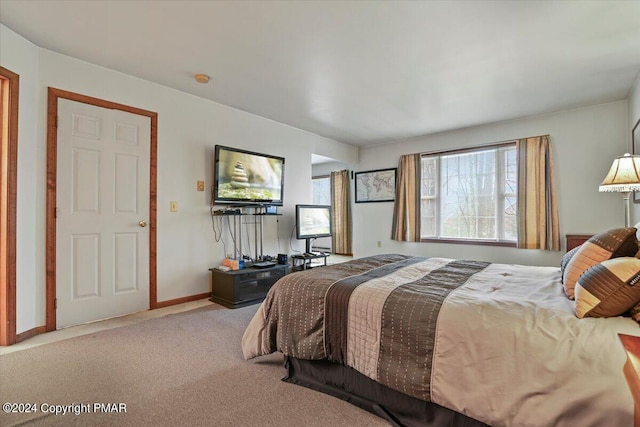 carpeted bedroom with baseboards