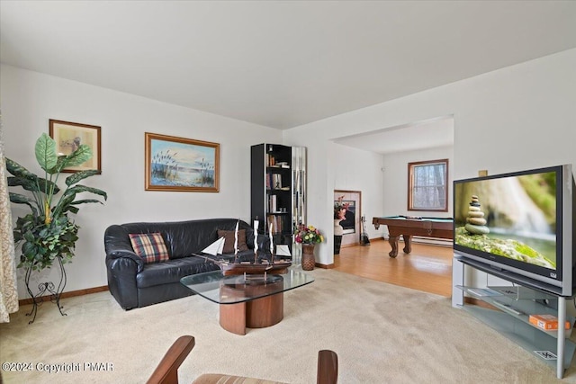 carpeted living area featuring billiards, baseboards, and wood finished floors