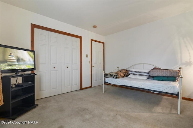 carpeted bedroom featuring baseboards