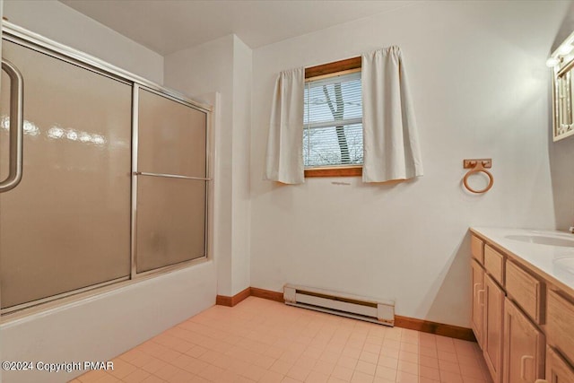 full bath featuring a baseboard radiator, shower / bath combination with glass door, vanity, and baseboards