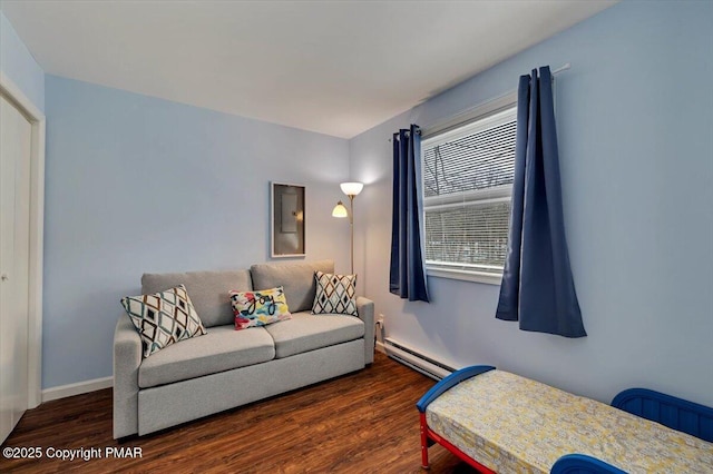 bedroom featuring dark hardwood / wood-style floors and baseboard heating