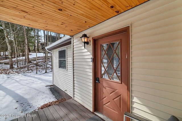 view of snow covered property entrance