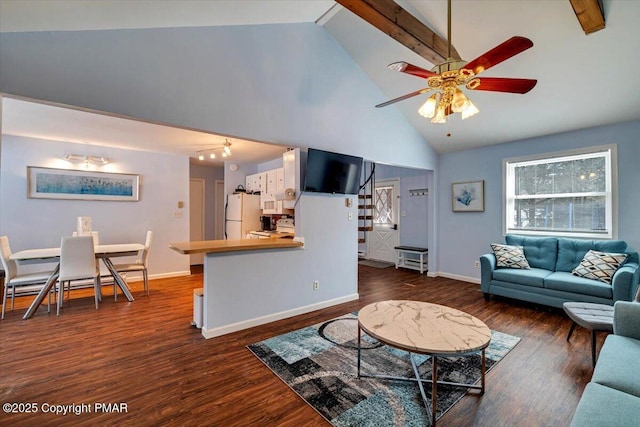 living room featuring ceiling fan, dark hardwood / wood-style floors, and high vaulted ceiling