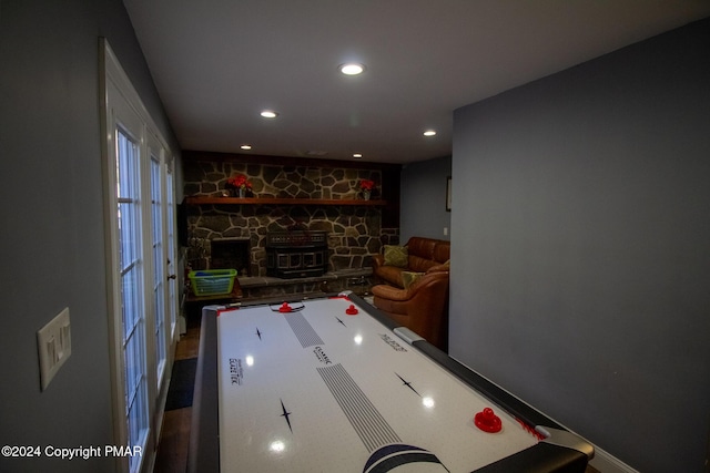 playroom featuring a fireplace and recessed lighting