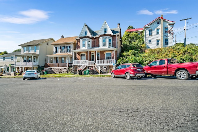 view of front of home with brick siding and a residential view