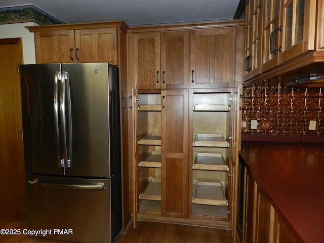 kitchen featuring hardwood / wood-style floors and stainless steel fridge