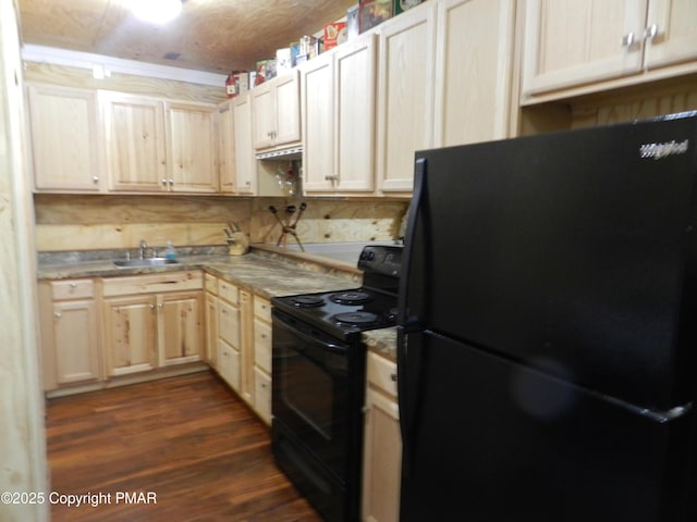 kitchen featuring a sink, black appliances, dark wood-type flooring, and light brown cabinetry