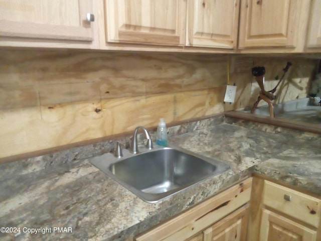 kitchen featuring sink and light brown cabinets