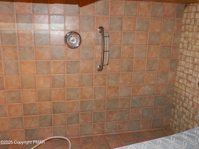 bathroom with a tile shower