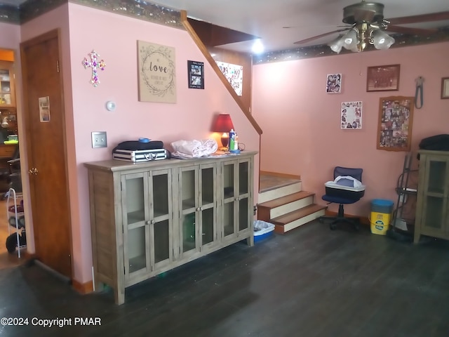 recreation room with ceiling fan and dark hardwood / wood-style flooring