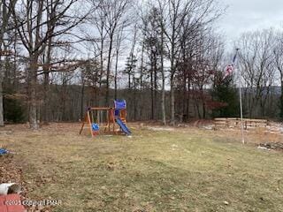 view of jungle gym featuring a yard