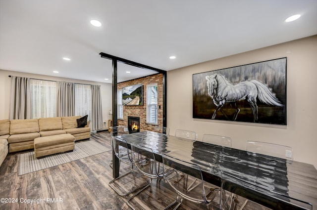 living area featuring plenty of natural light, a fireplace, wood finished floors, and recessed lighting