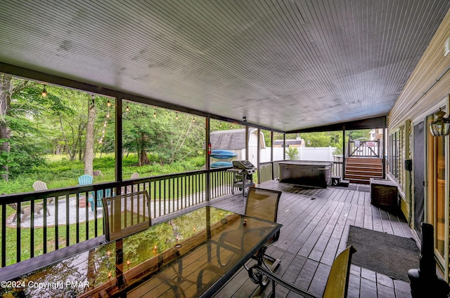 unfurnished sunroom with lofted ceiling