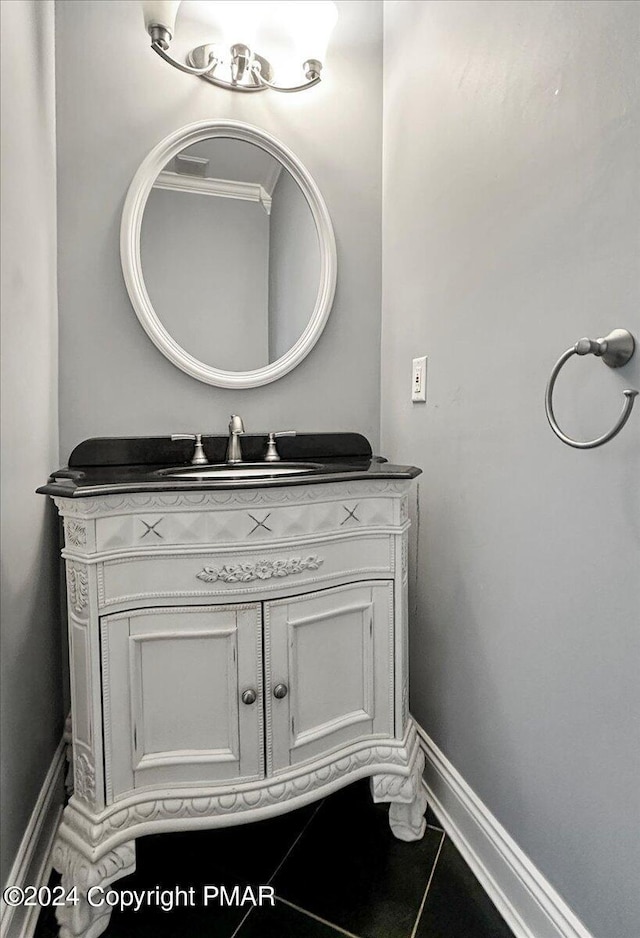 bathroom with vanity and baseboards