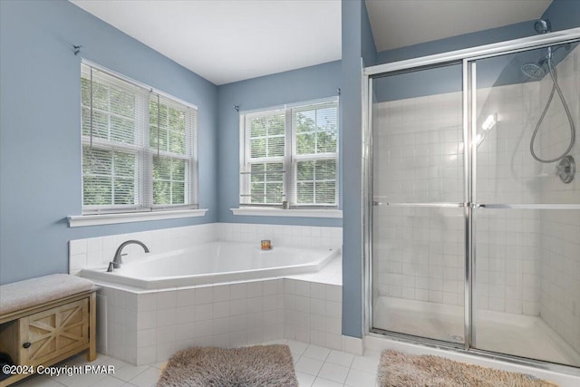 full bath with a bath, a shower stall, and tile patterned floors