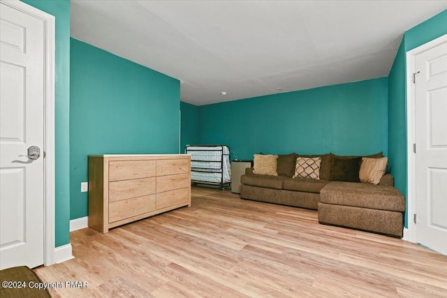 interior space featuring wood finished floors and baseboards