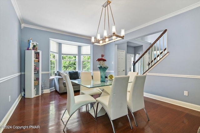 dining room featuring crown molding, baseboards, stairway, hardwood / wood-style flooring, and a notable chandelier