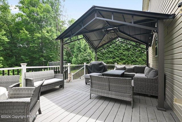 wooden deck with a grill and outdoor lounge area