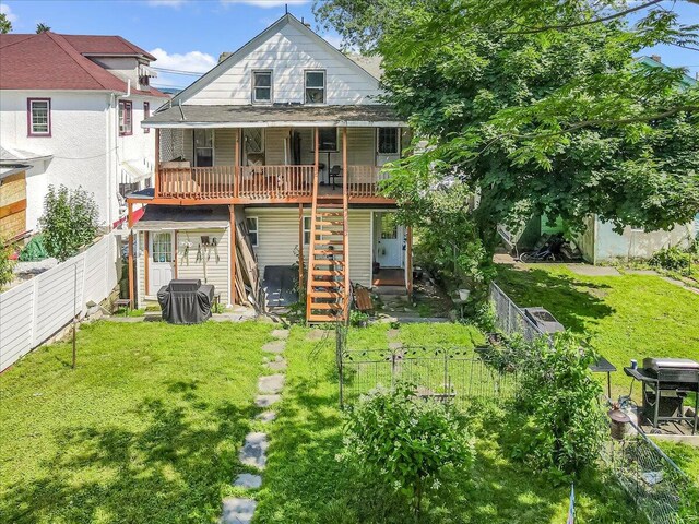 213 N St Fran Cabrini Ave, Scranton, PA 18504 - rear view of property featuring stairs, a fenced backyard, and a deck