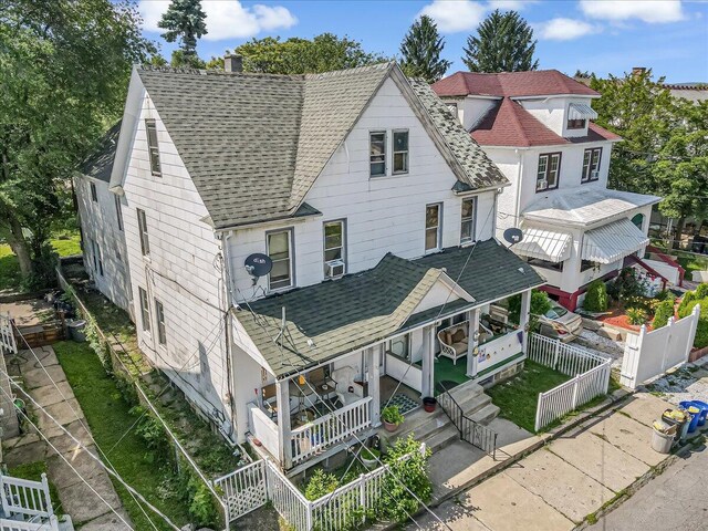 213 N St Fran Cabrini Ave, Scranton, PA 18504 - view of front of home featuring a shingled roof, a porch, a chimney, and a fenced backyard
