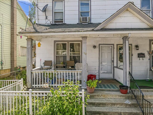 213 N St Fran Cabrini Ave, Scranton, PA 18504 - entrance to property featuring covered porch, roof with shingles, and cooling unit