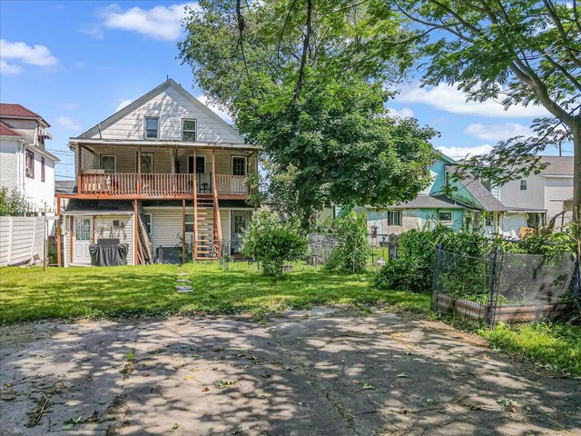 213 N St Fran Cabrini Ave, Scranton, PA 18504 - back of property with stairway, a patio area, and a wooden deck
