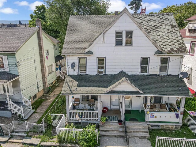 213 N St Fran Cabrini Ave, Scranton, PA 18504 - view of front of house featuring a fenced backyard and a shingled roof