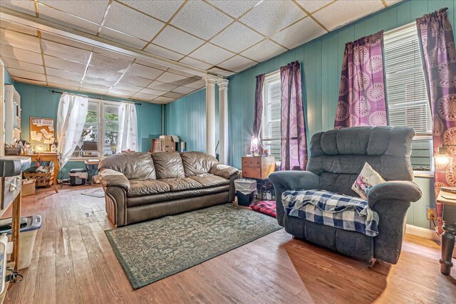 213 N St Fran Cabrini Ave, Scranton, PA 18504 - living area featuring ornate columns, wood finished floors, and a drop ceiling