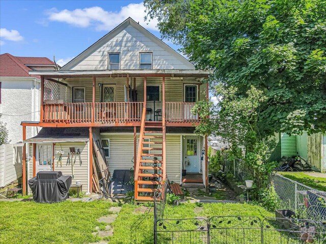 213 N St Fran Cabrini Ave, Scranton, PA 18504 - rear view of property featuring a fenced backyard, stairs, and a wooden deck