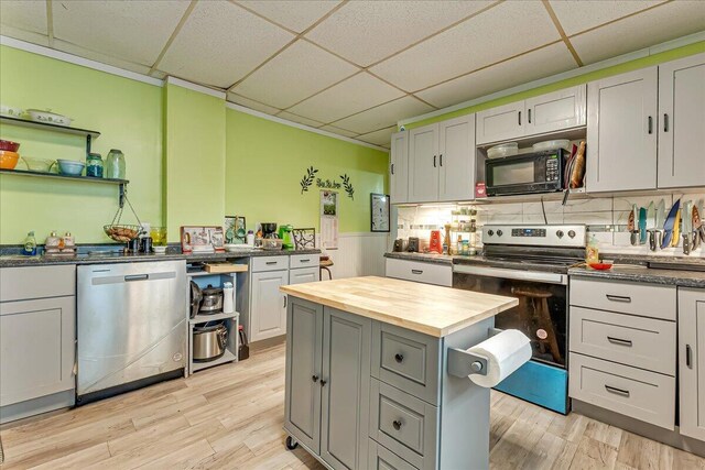 213 N St Fran Cabrini Ave, Scranton, PA 18504 - kitchen with appliances with stainless steel finishes, butcher block countertops, a paneled ceiling, gray cabinetry, and light wood finished floors