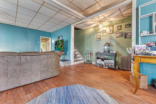 213 N St Fran Cabrini Ave, Scranton, PA 18504 - living area with radiator, stairs, a paneled ceiling, and wood finished floors
