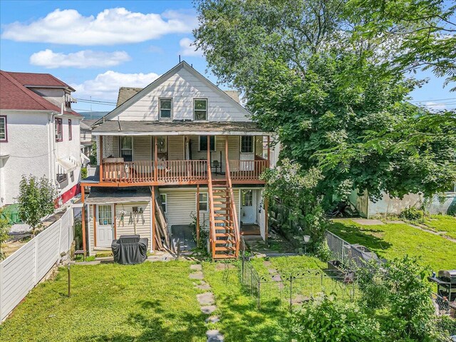 213 N St Fran Cabrini Ave, Scranton, PA 18504 - back of property featuring stairway, a fenced backyard, and a wooden deck