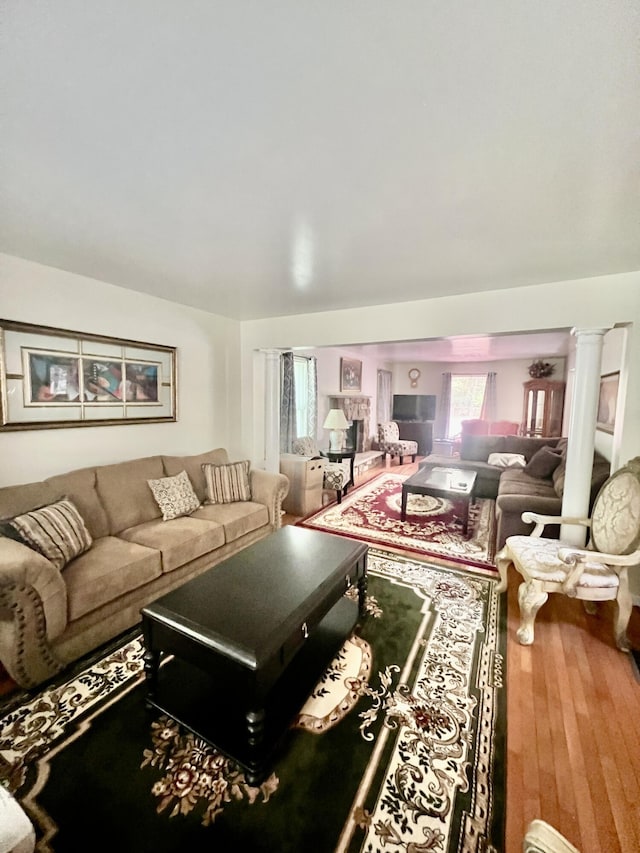 512 Bombur Ln, Tamiment, PA 18371 - living area featuring wood finished floors and ornate columns