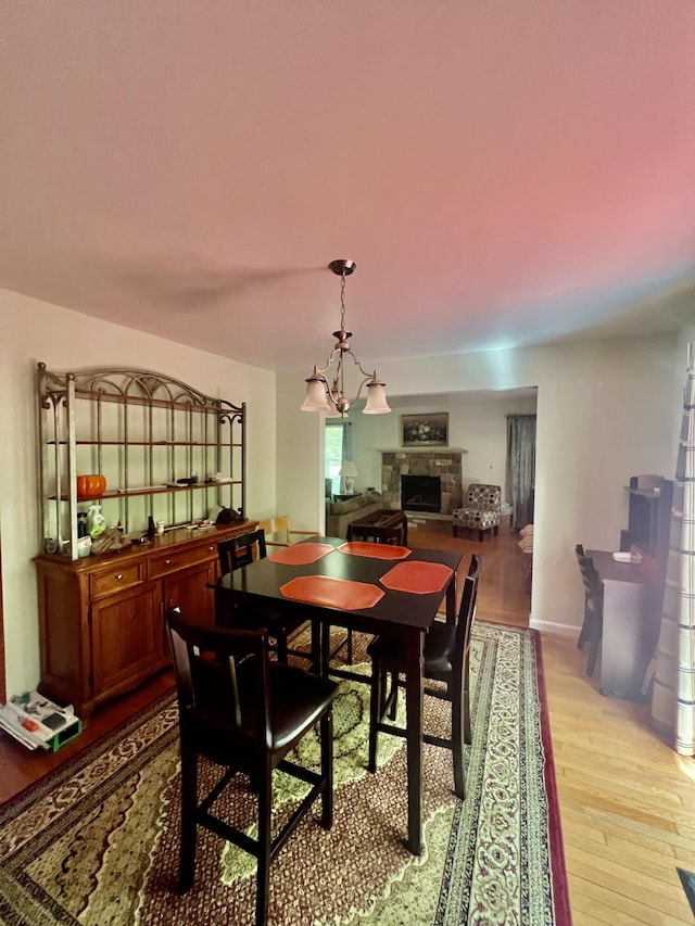 512 Bombur Ln, Tamiment, PA 18371 - dining space featuring light wood finished floors and a fireplace