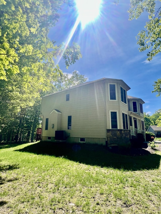 512 Bombur Ln, Tamiment, PA 18371 - view of property exterior with a yard and central AC unit