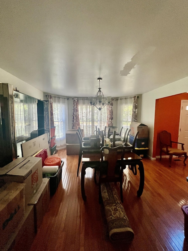 512 Bombur Ln, Tamiment, PA 18371 - dining area featuring wood-type flooring, a chandelier, and a textured ceiling