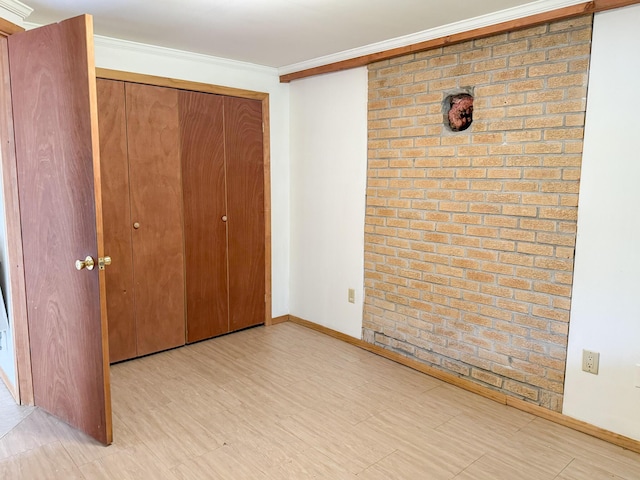 4751 Brentwood Dr, Tobyhanna, PA 18466 - unfurnished bedroom with a closet, crown molding, and baseboards
