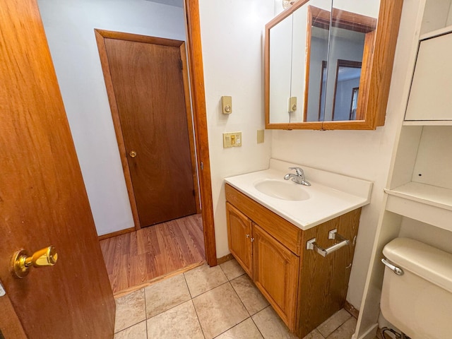 4751 Brentwood Dr, Tobyhanna, PA 18466 - half bathroom featuring toilet, vanity, and tile patterned floors